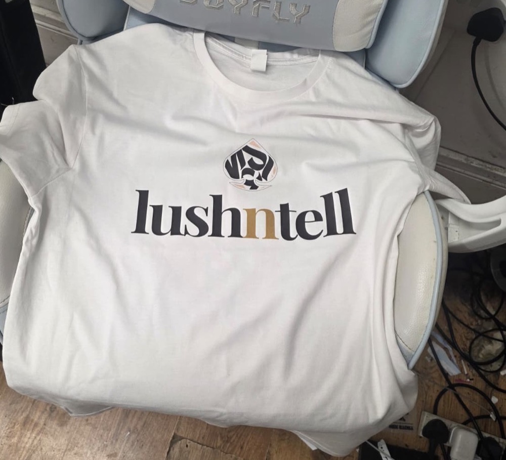 Second white t-shirt from the same printed batch, showing consistent logo placement, IT Wheel London E1