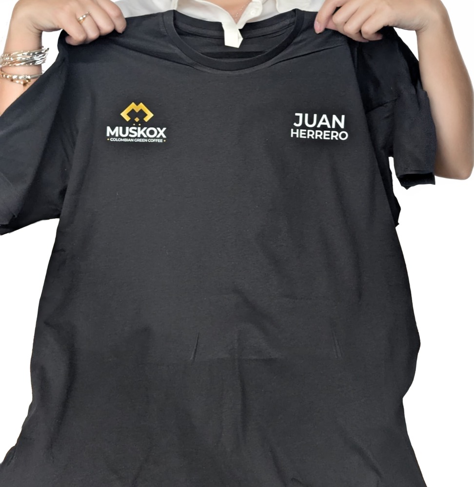 Black t-shirt printed with a company logo and a personalised staff name, printed by IT Wheel in London E1