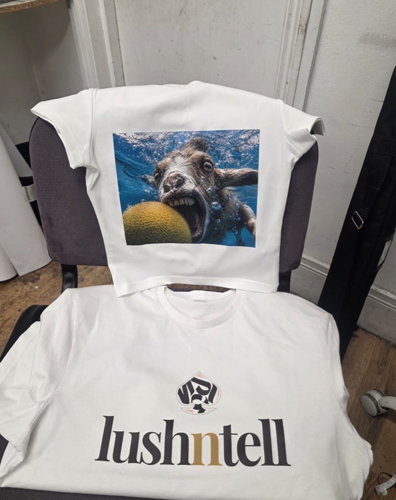 White cotton t-shirt with a full-colour photographic DTF print, photographed in the IT Wheel workshop in London E1