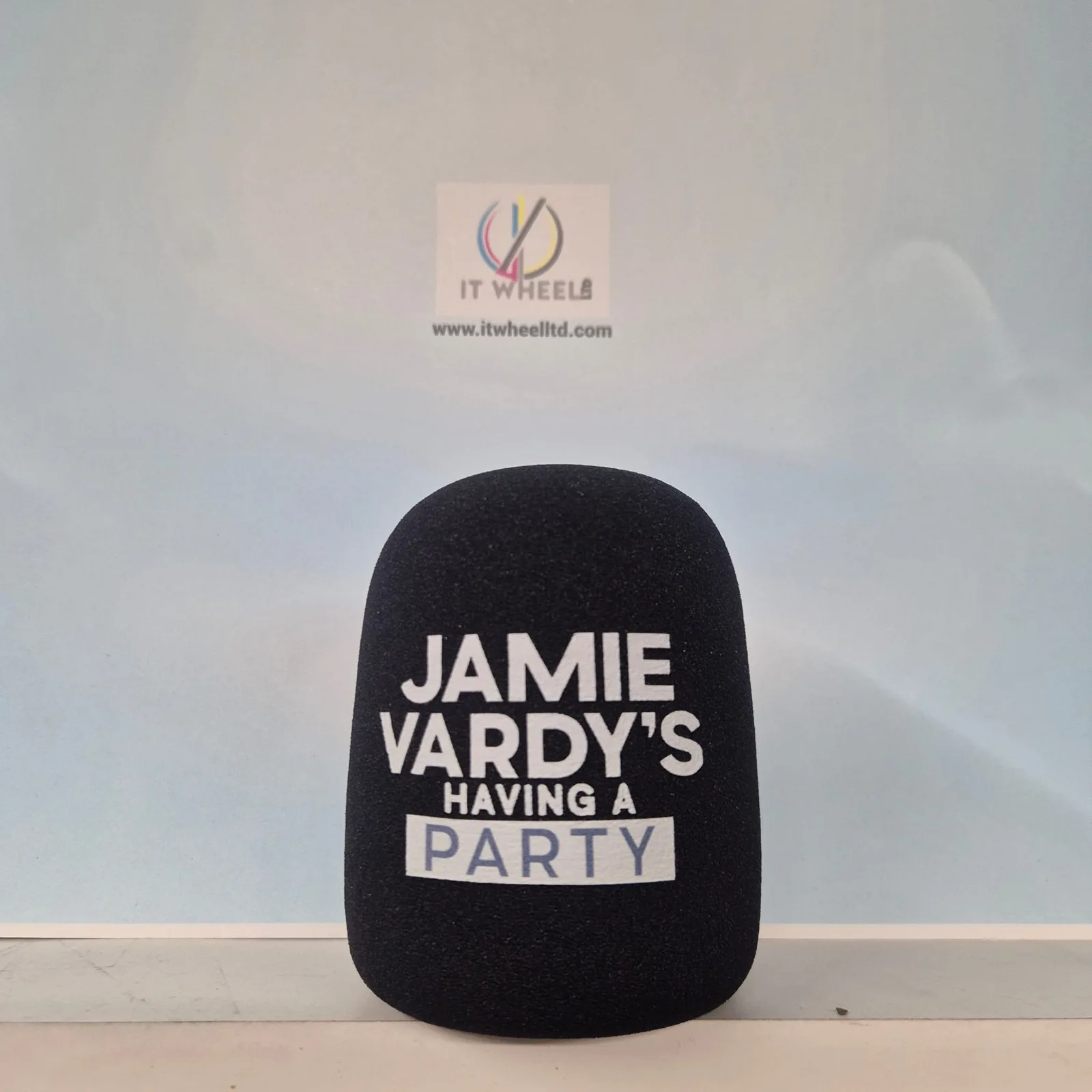 Black Rode PodMic foam cover custom printed with the Jamie Vardy's Having A Party podcast logo — printed same-day by IT Wheel London