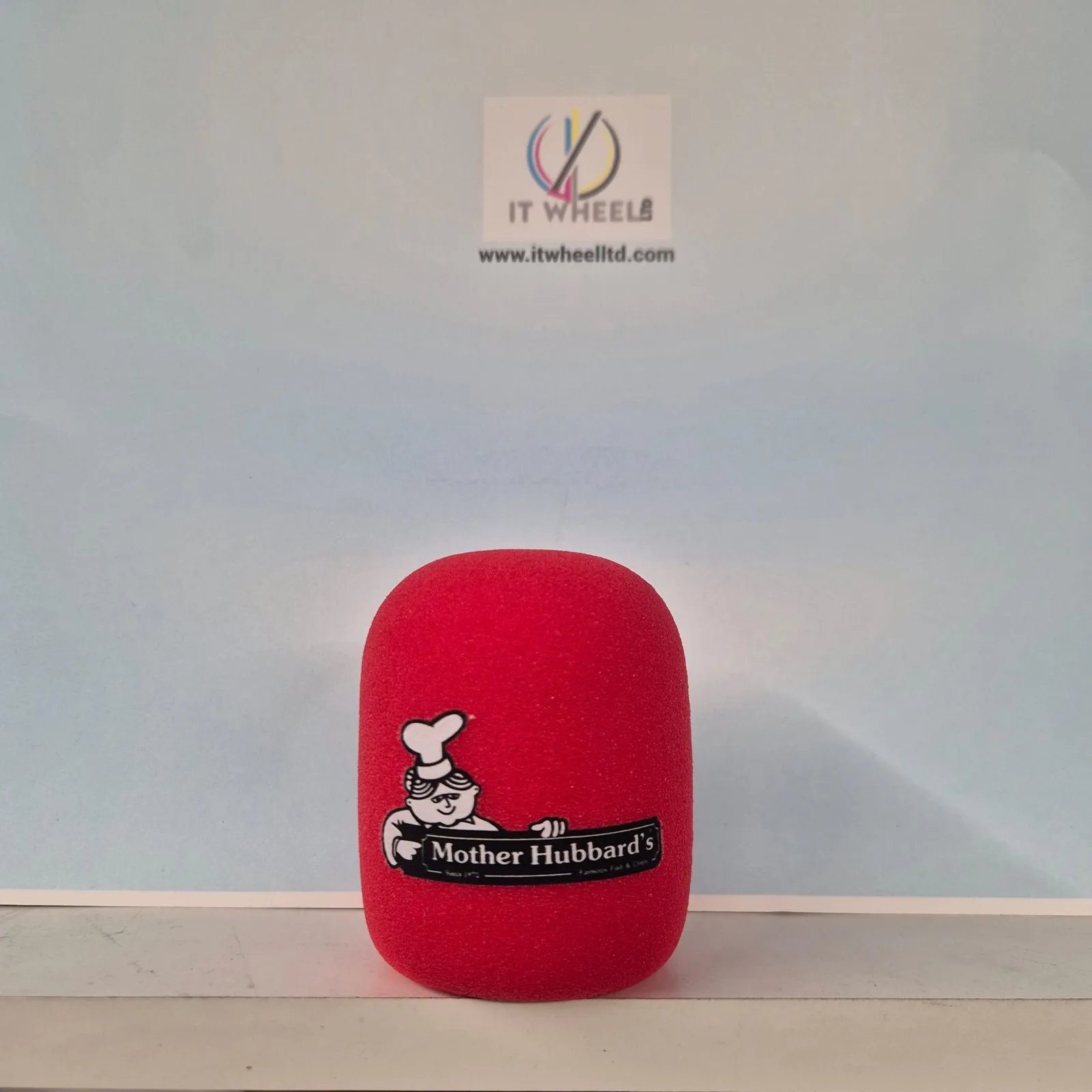 Red Rode PodMic foam windscreen custom printed with the Mother Hubbard's restaurant logo — real customer order from IT Wheel London