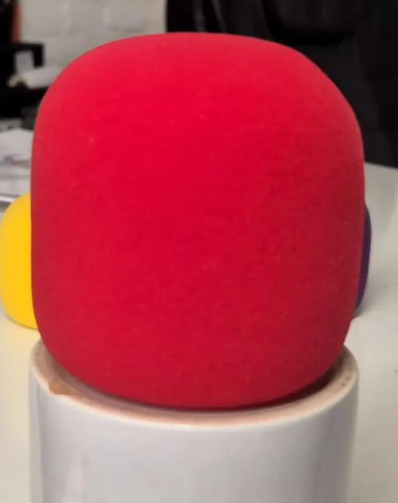 Blank red Rode Wireless Go II foam windshield, unprinted