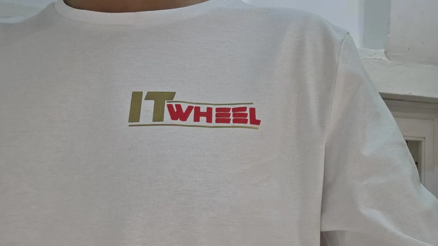 IT Wheel branded t-shirt with a left-chest logo, custom printed same day in London E1