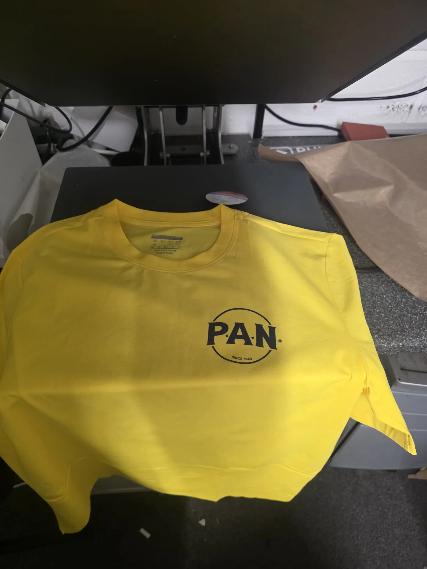 Same-day custom t-shirt with a P.A.N chest logo print, printed in London