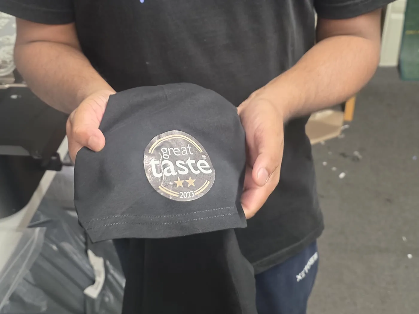 Great Taste 2023 award badge printed on a t-shirt sleeve by IT Wheel London